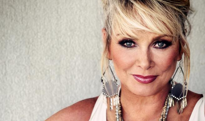 National Treasure Cheryl Baker, looking as gorgeous as ever, is giving a cheeky smile to the camera, thinking of coming to this event, definitely time to be Making Your Mind Up...