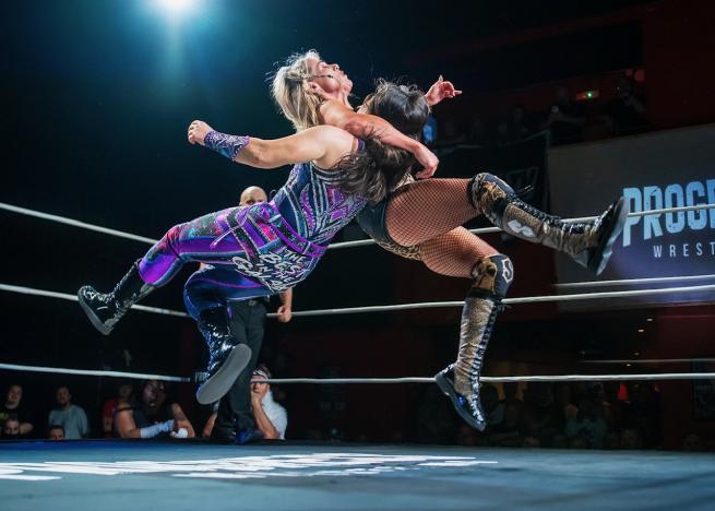 two female wrestlers in ring 