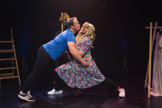 A rubbish Romeo trying to kiss a very reluctant bearded Juliet