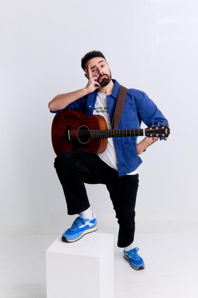 Anesti Danelis with a guitar