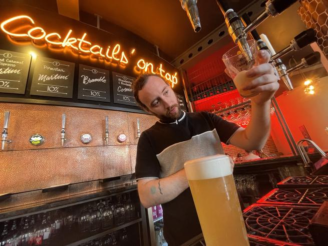A barman pulling a pint