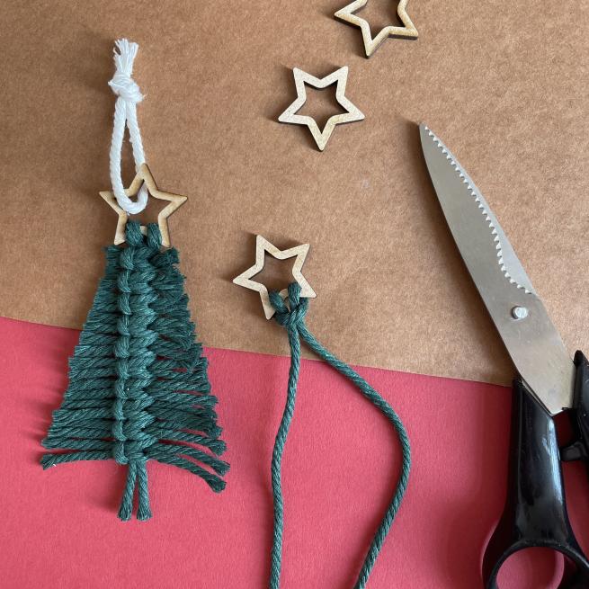 A photograph of macrame Christmas tree decoration in green