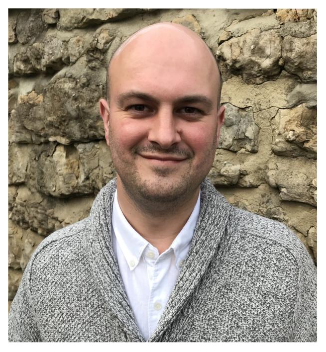 A photographic portrait of author/illustrator Mark Bradley