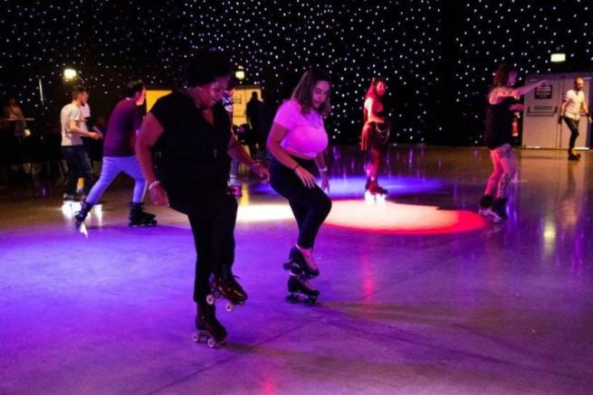 Two people roller dancing.