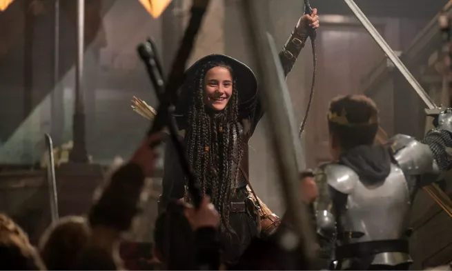 Robin cheers triumphantly before a crowd of dissomulated acolytes.