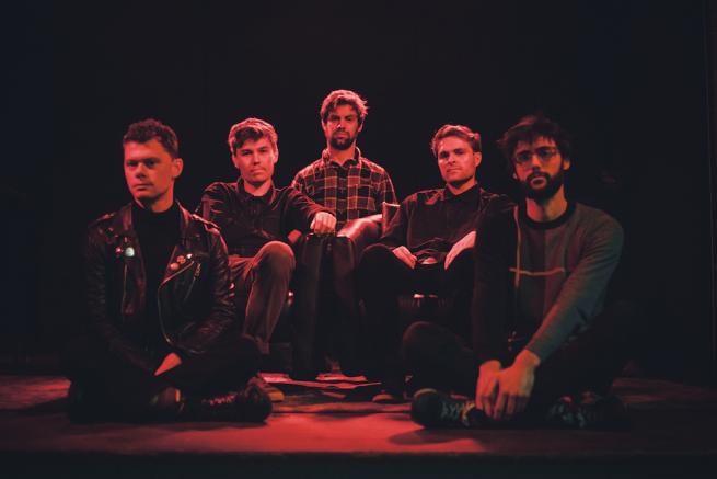 The band members of Wandering Monster - seated