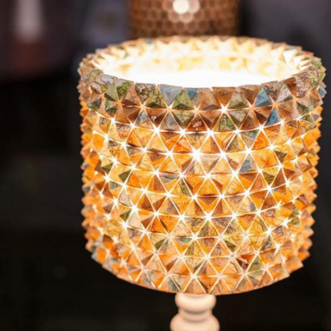 A photograph of a sculptural lampshade made using OS maps