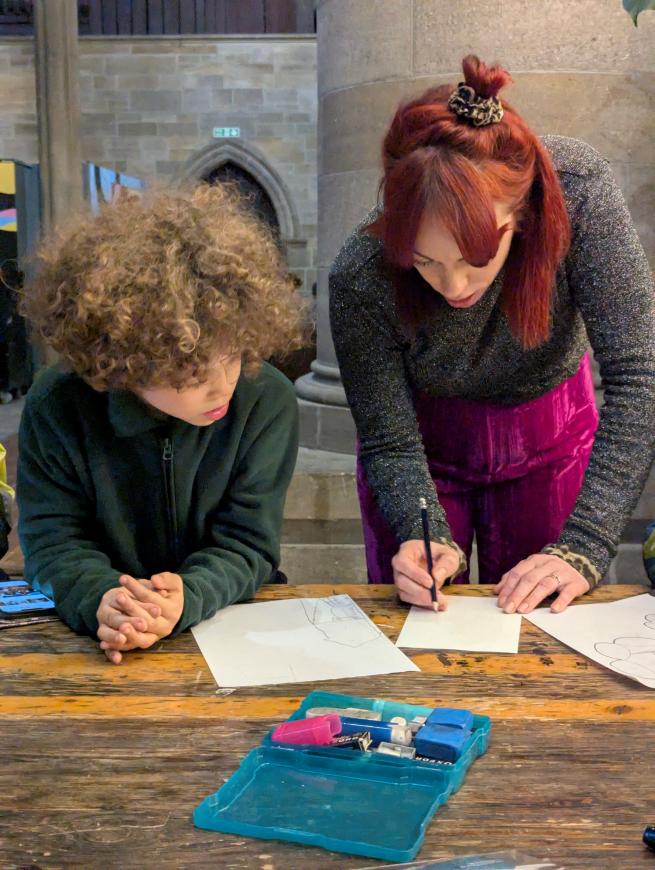 Image of Poppy and Child Drawing