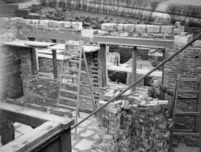 a picture of workmen constructing the Abbey House street Harewood Square in the 1959s. 