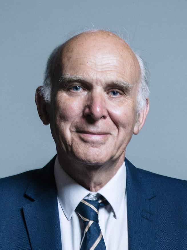 Head shot of economist Vince Cable. He is wearing a suit and tie. He is looking directly towards the camera.