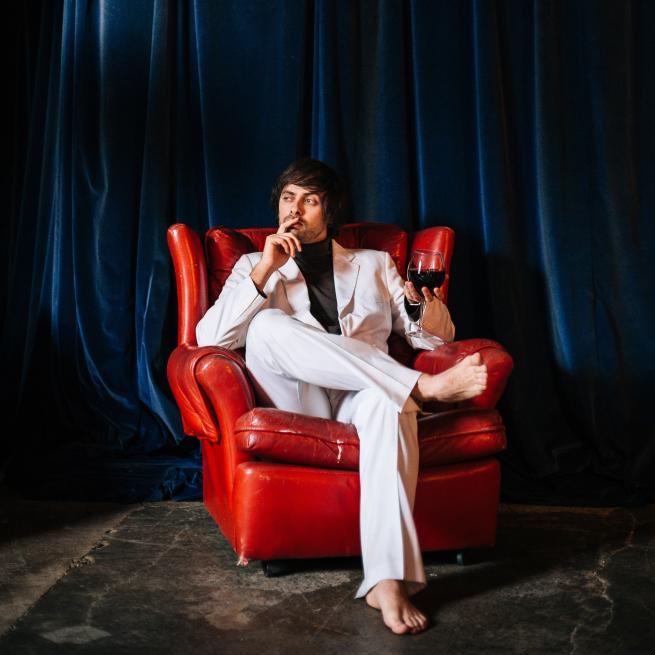 Marcel drinking wine. 