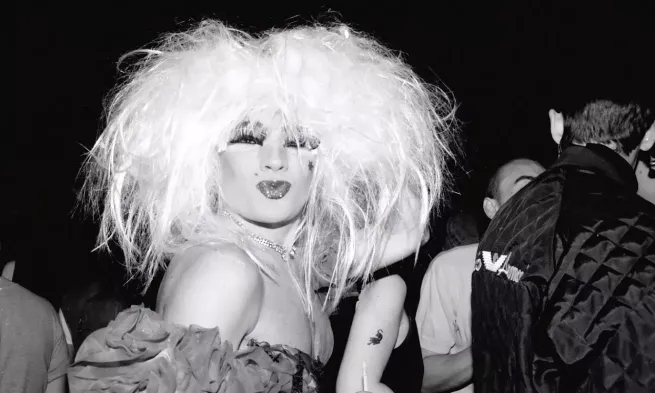 A still from the Linden Archives, of a club-goer pouting for the camera.