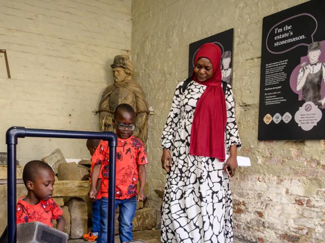 Family looking at equipment on Home Farm