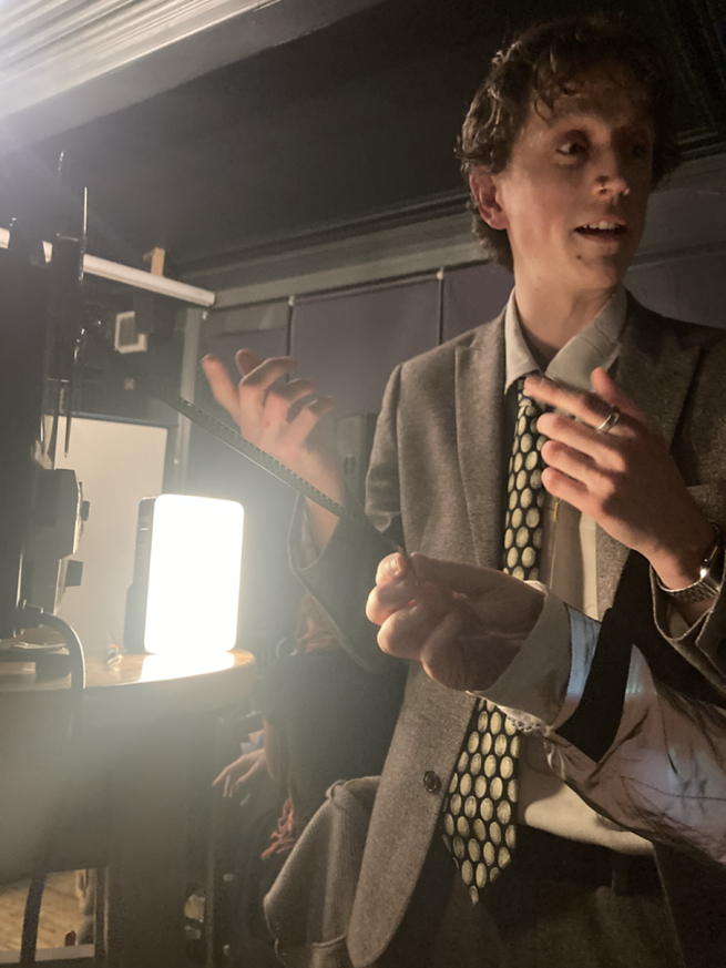 Jacob talking through projector.