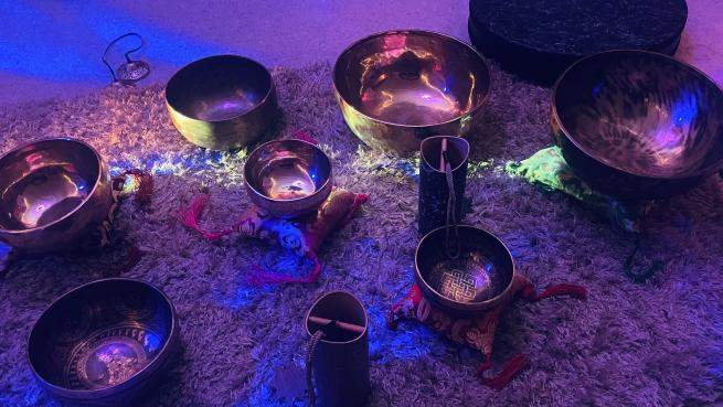 A collection of singing bowls and sound healing chimes