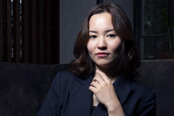 A female looking into the distance.