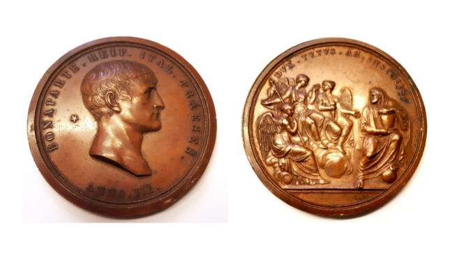 Two sides of the same bronze coin, featuring the profile of Napoleon Bonaparte
