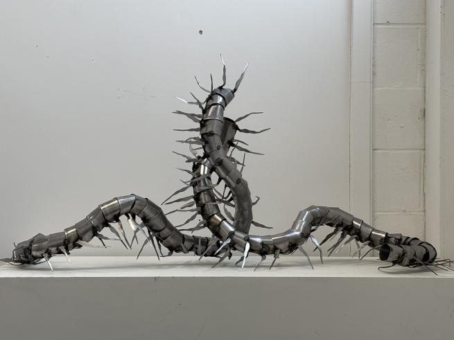 Embrace insectoid metal sculpture by Lily Honey-Doyle