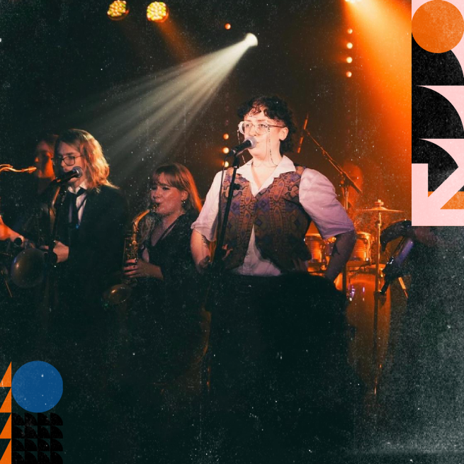 A group of 3 musicians performing on stage