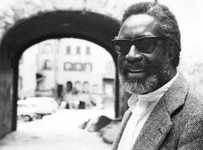 Portrait of Bill Dixon, smiling, with sunglasses