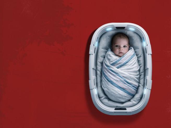 Baby in a bed on a red background
