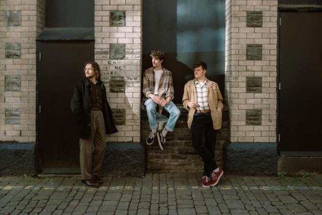 Eddie Gripper trio in doorway