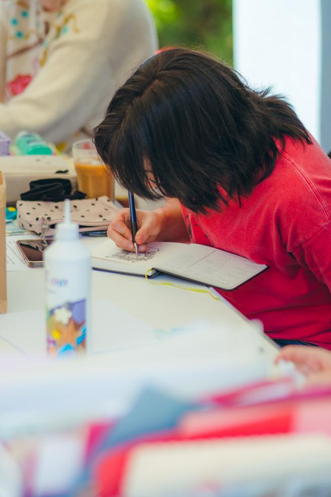 Person doodling in a notebook