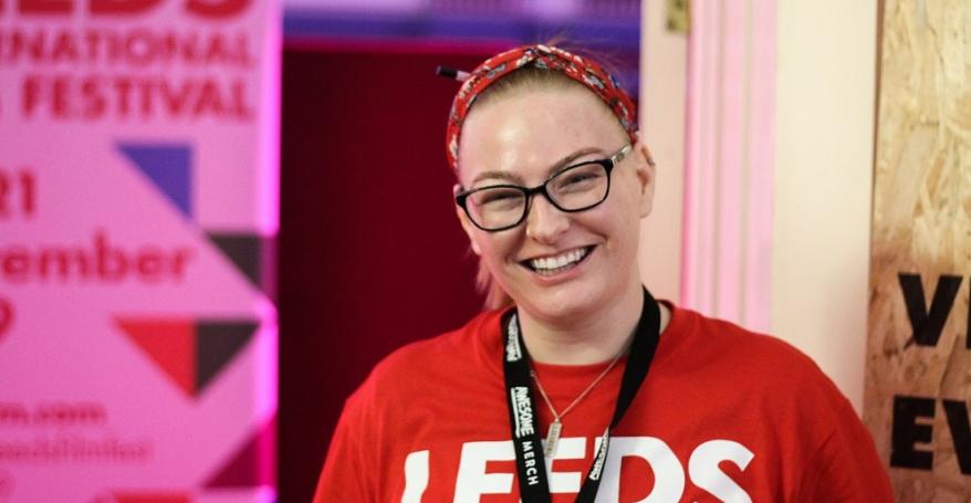 LIFF volunteer wearing a red LIFF t-shirt and smiling