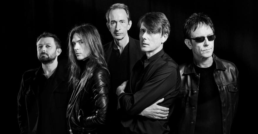 The 5 members of the band Suede looking straight at the camera