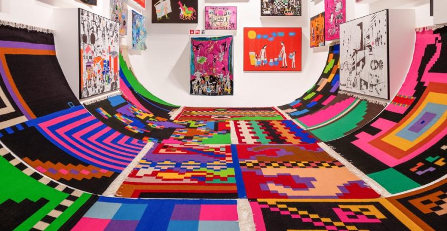 a large room filled with colourful artworks of all shapes and sizes 