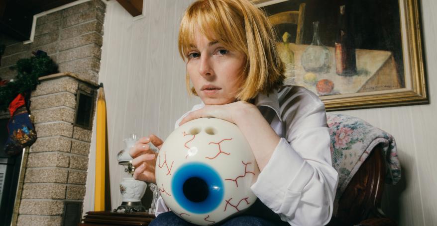 Fenne Lily holding a giant eyeball