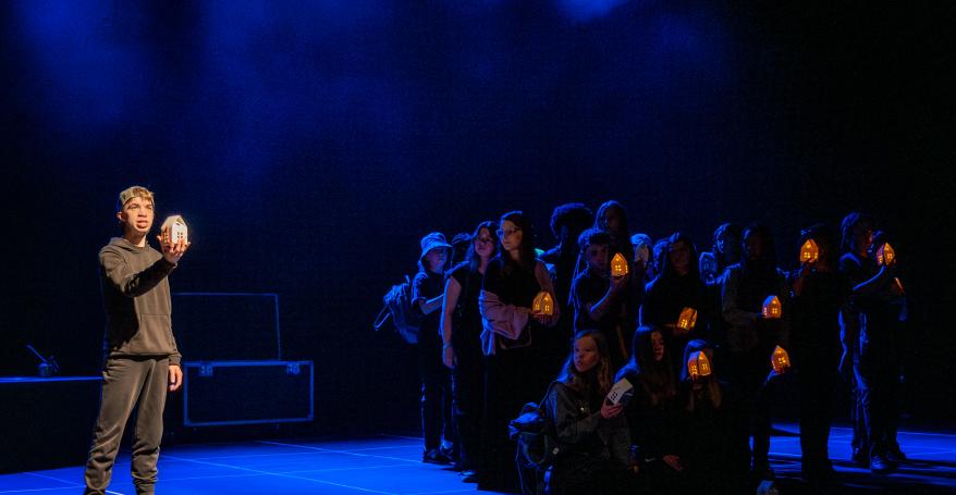 A group of young performers on stage