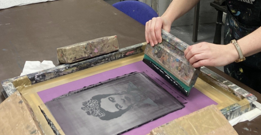 An image of Frida Kahlo being screen printed on to a t-shirt
