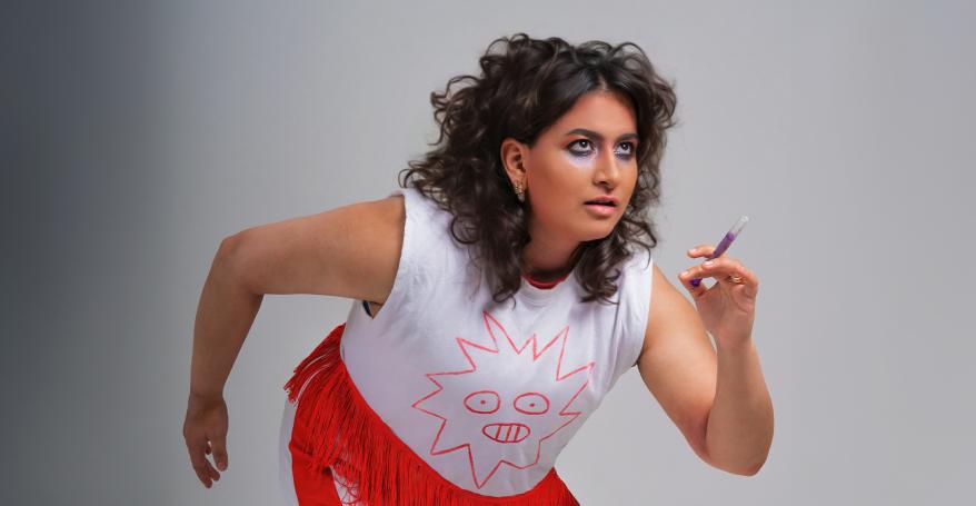 A woman poses as if she's about to start a race.