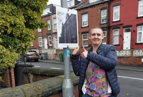 woman with her thumbs up