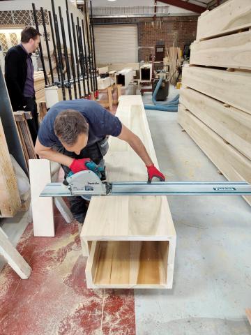 someone working on an organ pipe