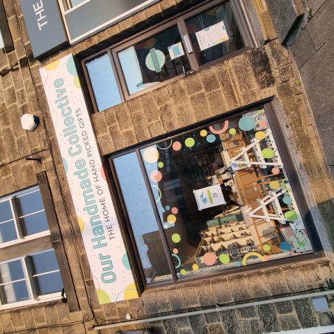 Shop front and window display of Our Handmade Collective gift shop