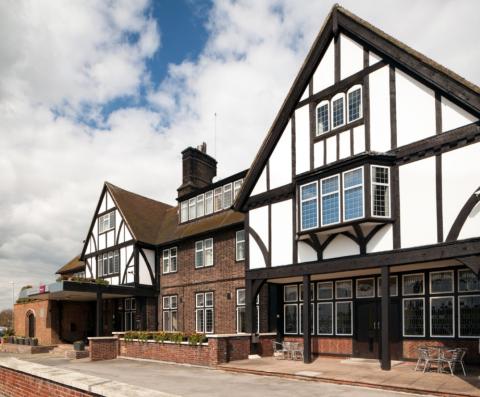 Picture of the front of the hotel, Tudor finish gabled building 