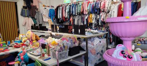 Photo of the inside of bundles showing toys and clothes