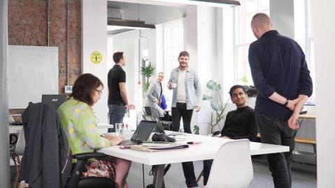 Image of office workers working in modern bright office