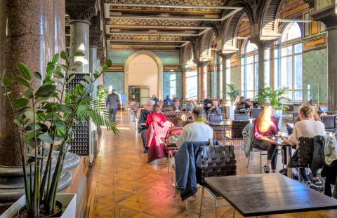 Few could argue against the charms of the Tiled Hall Cafe. Part of the huge building which houses both Leeds Central Library and Leeds Art Gallery, this magnificent arched space is photogenic and comes with coffee. Enter through the entrance to Leeds Art Gallery.The Tiled Hall was originally the main library reading room, and from 1888-1941 it functioned as a sculpture court. The magnificent Victorian hall was renovated extensively in 2007 with the help of English Heritage, to reveal the original fabric of…