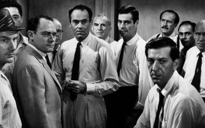 A photograph from 12 Angry Men featuring 11 of the jurors.