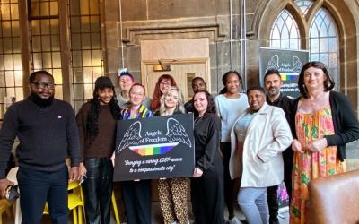 Multiple people stood together for group photo