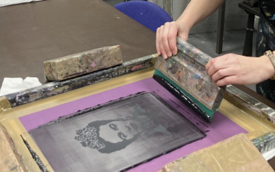 An image of Frida Kahlo being screen printed on to a t-shirt