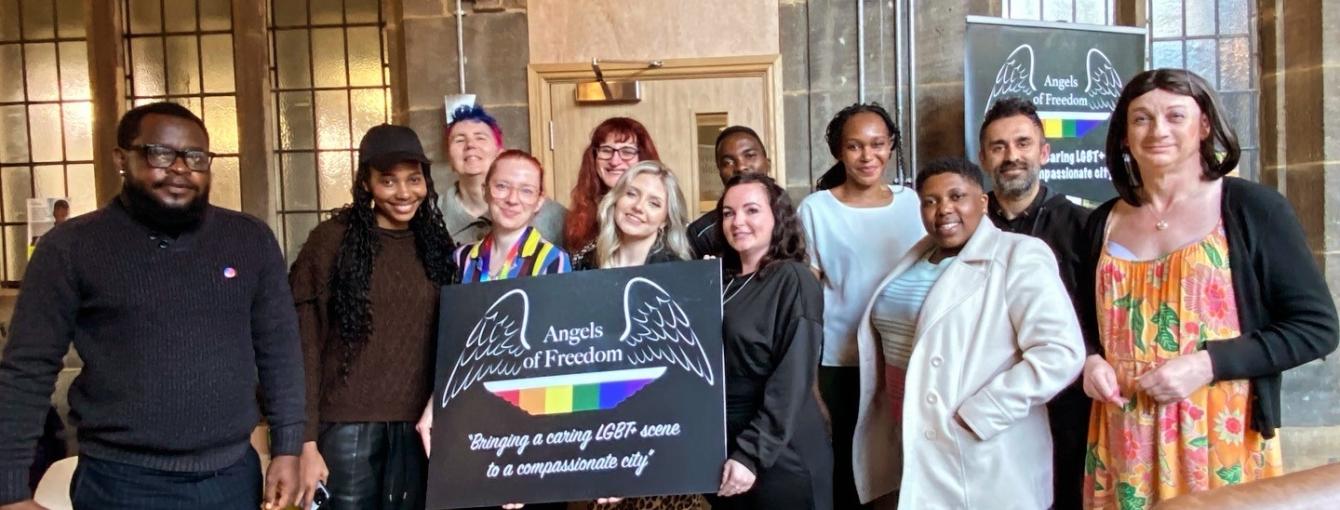 Multiple people stood together for group photo