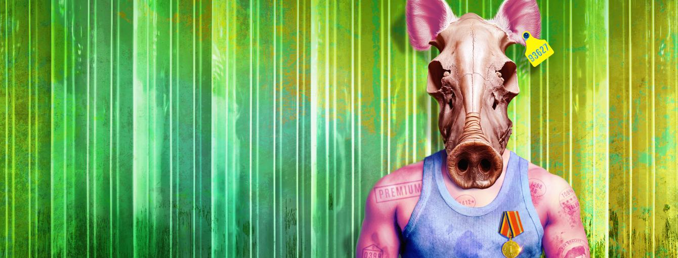 A toned, bruised body stands wearing a dirty vest with the skull of a pig as its head. Green PVC butcher’s curtains hang in the background and white text displays ‘Animal Farm.’